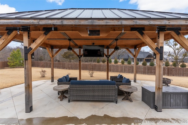 view of patio / terrace with a gazebo, an outdoor hangout area, and ceiling fan