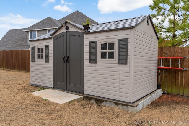 view of outdoor structure with a yard