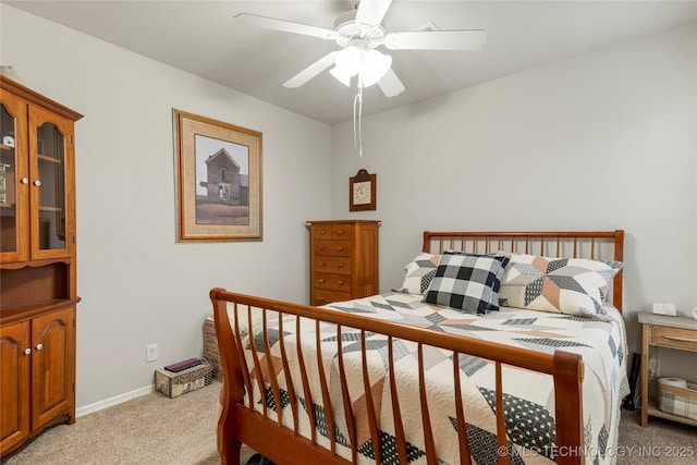 bedroom with ceiling fan and light colored carpet