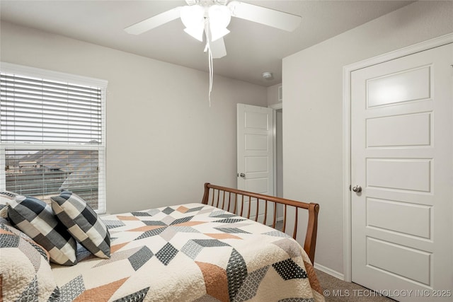 carpeted bedroom with ceiling fan