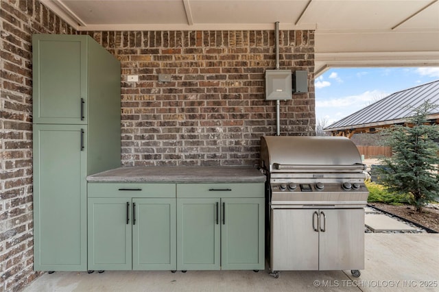 view of patio / terrace featuring grilling area and exterior kitchen