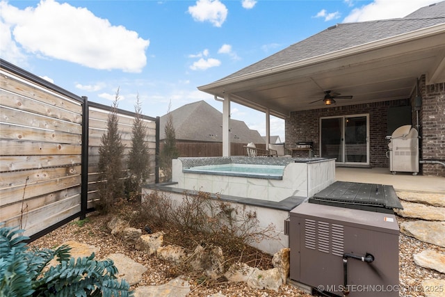 view of patio with ceiling fan