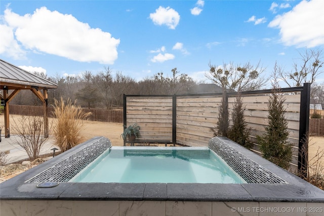 view of swimming pool with a gazebo