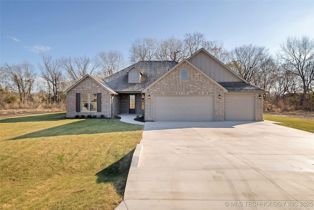 view of front of home featuring a garage and a front yard