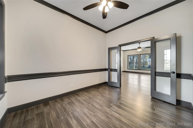 empty room featuring crown molding, dark hardwood / wood-style floors, and french doors