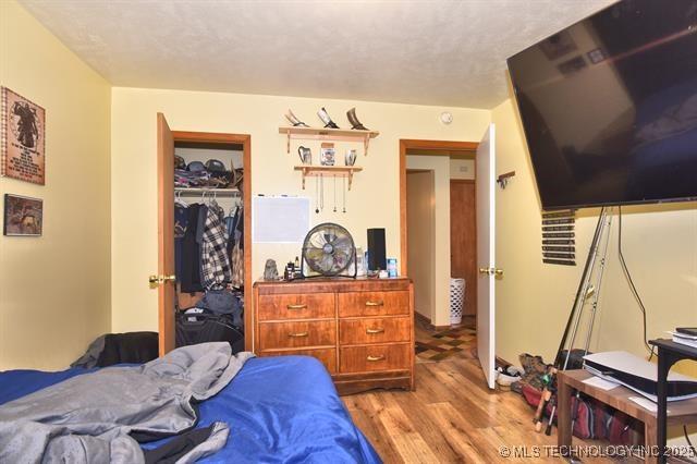 bedroom featuring a closet and light hardwood / wood-style flooring