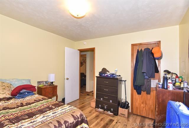 bedroom with light hardwood / wood-style flooring