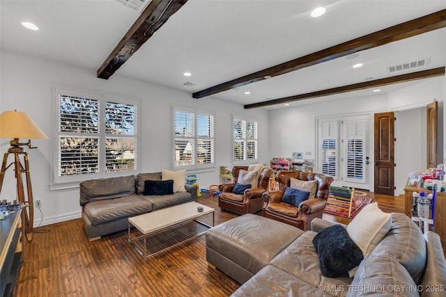 living room featuring hardwood / wood-style floors and beam ceiling