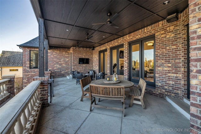 view of patio / terrace featuring a balcony and ceiling fan