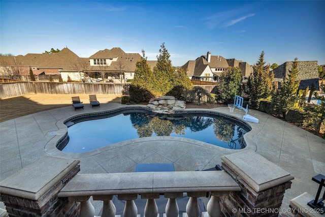 view of swimming pool featuring a patio