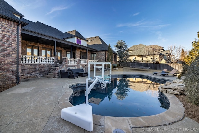 view of swimming pool featuring a pergola and a patio