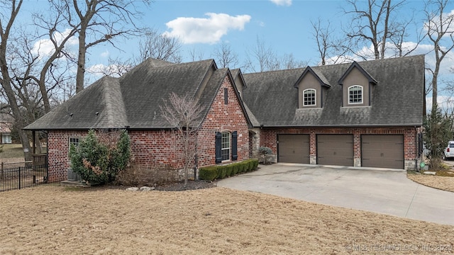 view of front of home featuring a garage and a front yard