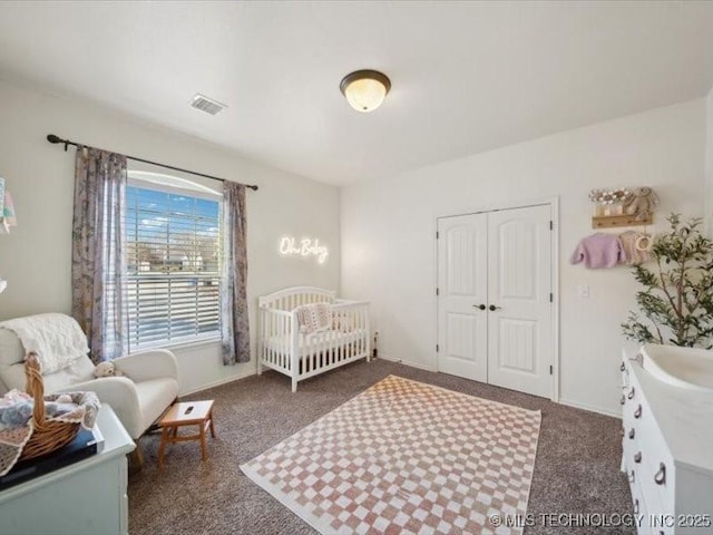 carpeted bedroom featuring a closet