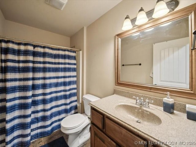 bathroom featuring vanity, toilet, and a shower with shower curtain