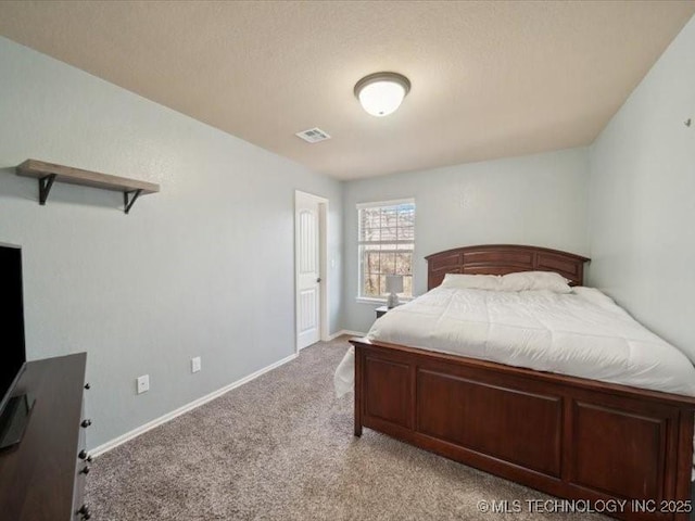 bedroom featuring light carpet