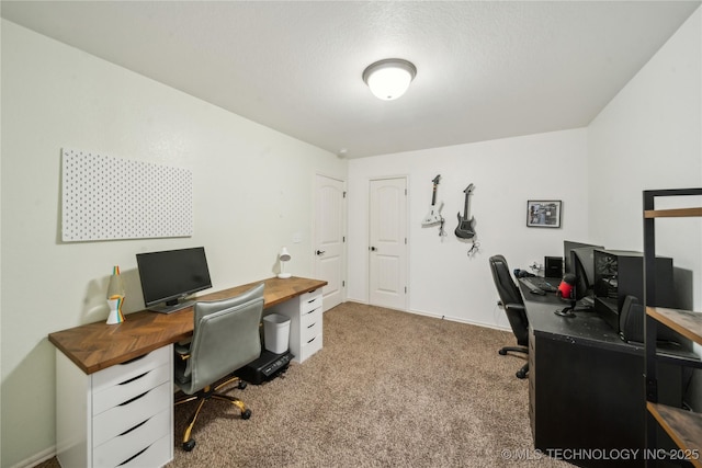 carpeted office space with a textured ceiling