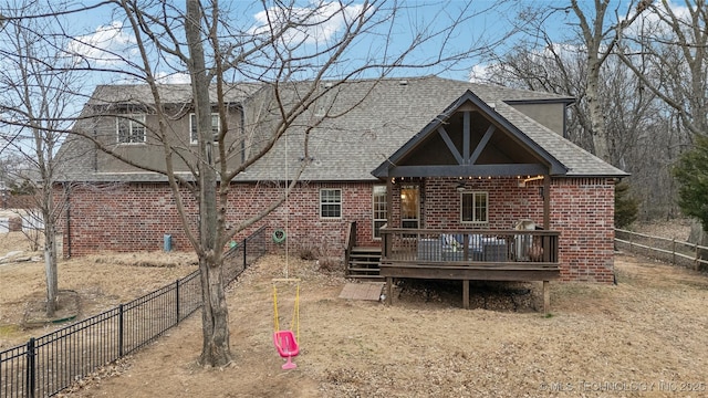 back of house with a wooden deck