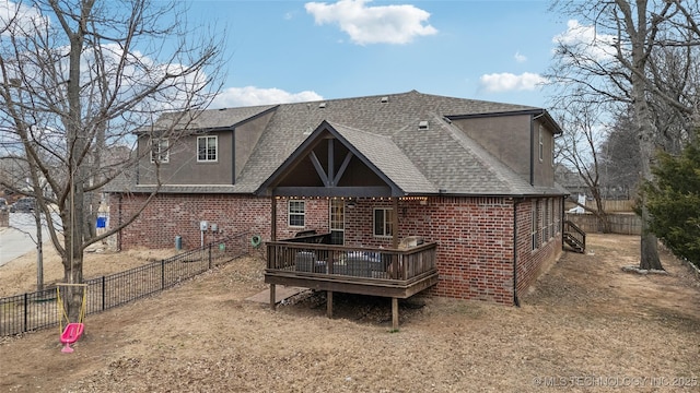 back of property featuring a wooden deck