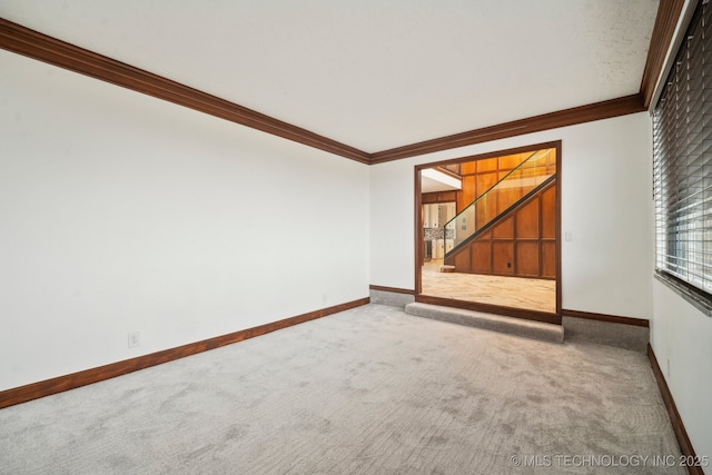 6642 E 60th Pl, Tulsa, OK 74145 - carpeted spare room with ornamental molding and baseboards