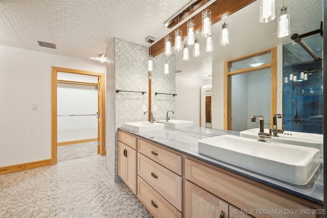 bathroom featuring vanity and a textured ceiling