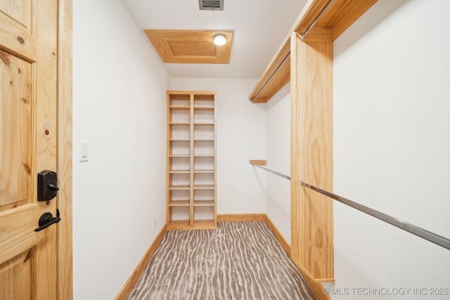 6642 E 60th Pl, Tulsa, OK 74145 - walk in closet with carpet floors and attic access