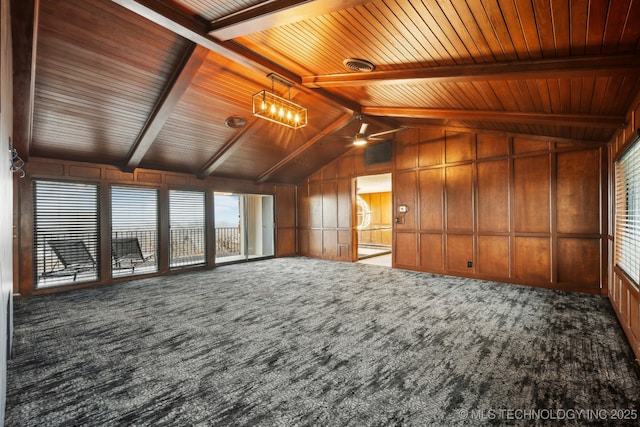 6642 E 60th Pl, Tulsa, OK 74145 - unfurnished living room featuring carpet floors, wooden ceiling, ceiling fan, and wood walls