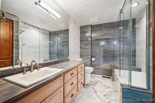 6642 E 60th Pl, Tulsa, OK 74145 - bathroom with vanity, marble tiled floors, a textured ceiling, tile walls, and enclosed tub / shower combo