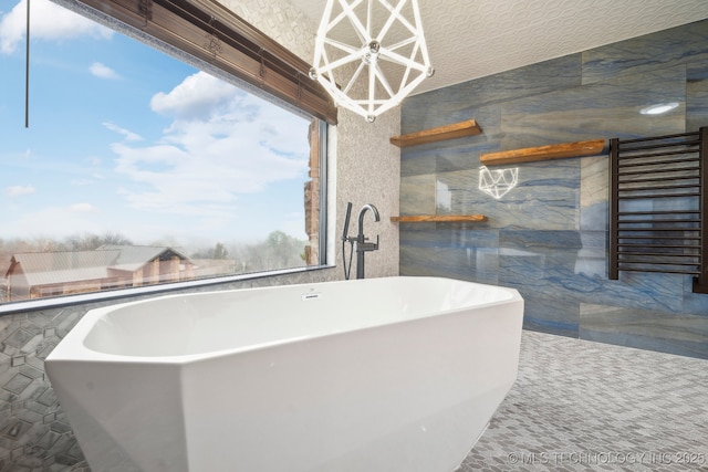 bathroom with tile walls, radiator, and a bathtub