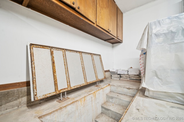 6642 E 60th Pl, Tulsa, OK 74145 - staircase featuring unfinished concrete floors