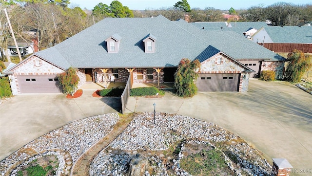 view of front of property with a porch and a garage