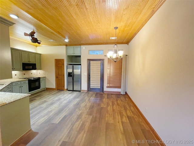 kitchen with black appliances, backsplash, hanging light fixtures, green cabinetry, and crown molding