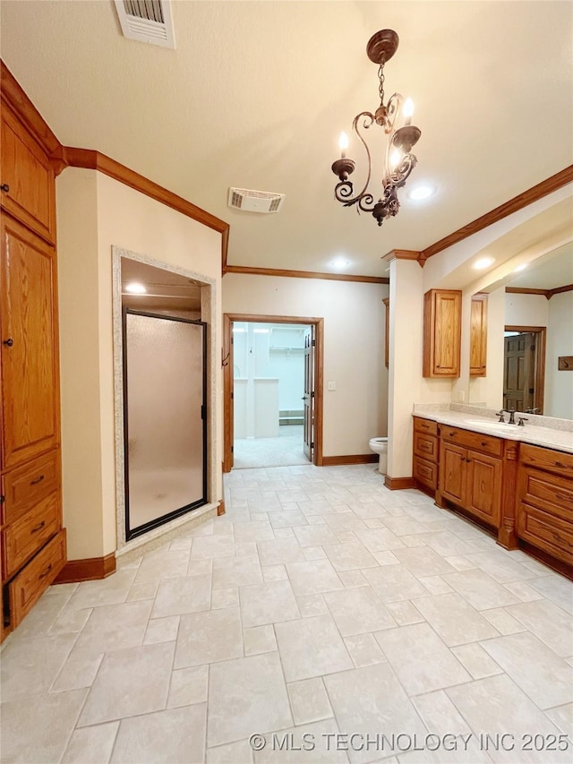 bathroom with vanity, walk in shower, a notable chandelier, toilet, and crown molding