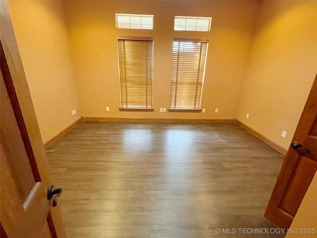 empty room featuring hardwood / wood-style floors