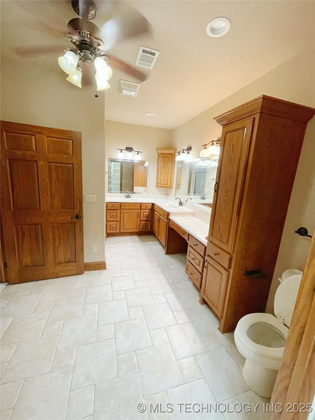 bathroom with ceiling fan and vanity