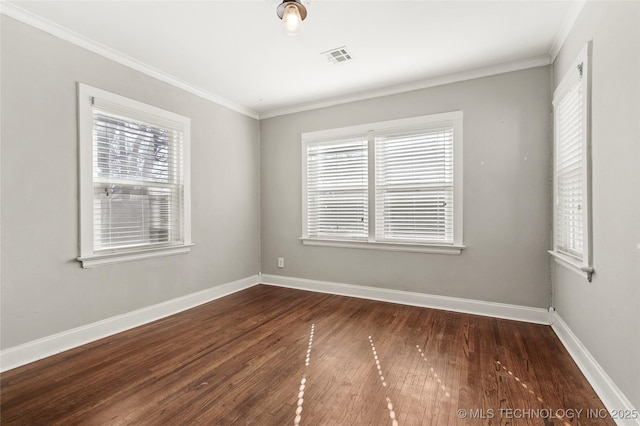 unfurnished room with ornamental molding and dark hardwood / wood-style floors