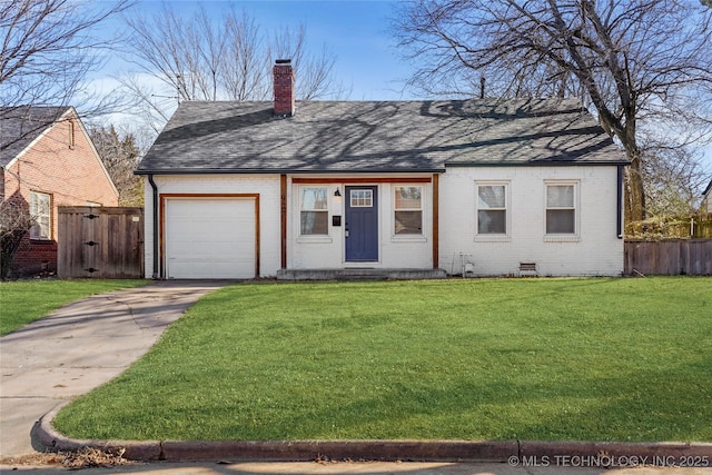 view of front of property featuring a garage and a front lawn