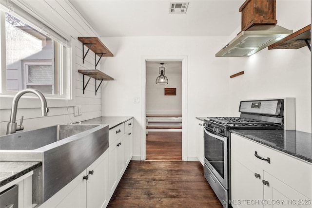 kitchen with sink, white cabinetry, island range hood, gas stove, and dark hardwood / wood-style flooring