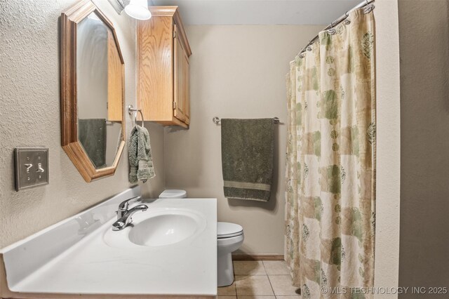 bathroom with vanity, a shower with curtain, tile patterned floors, and toilet