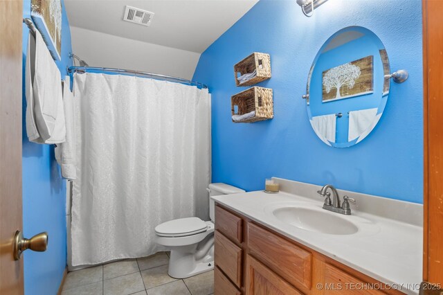 bathroom with a shower with curtain, tile patterned floors, toilet, and vanity