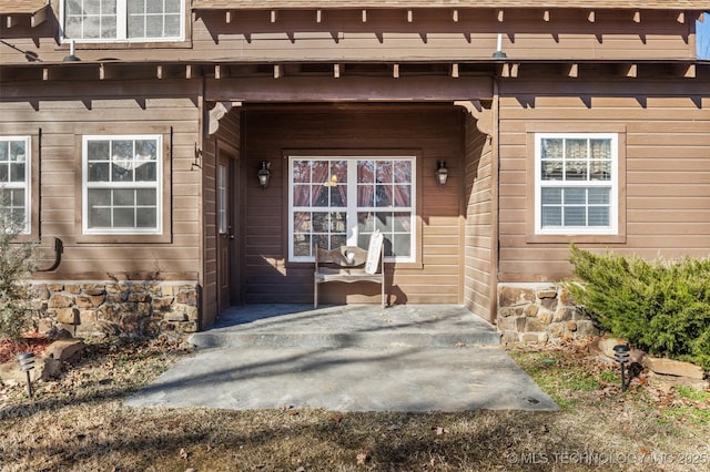 property entrance featuring covered porch