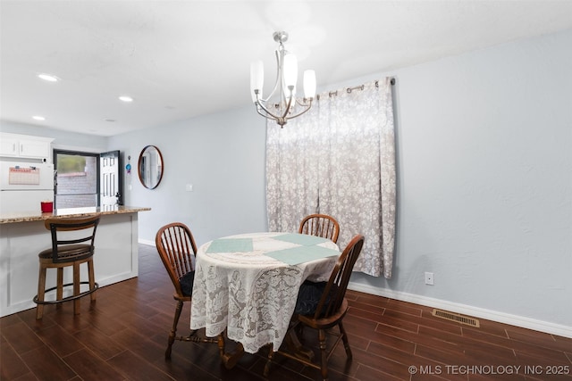 dining area with a chandelier