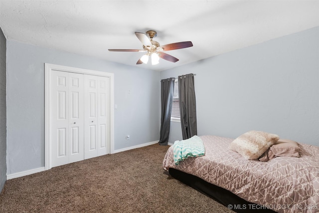 carpeted bedroom featuring a closet and ceiling fan