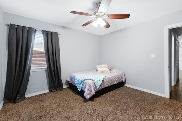 carpeted bedroom with ceiling fan