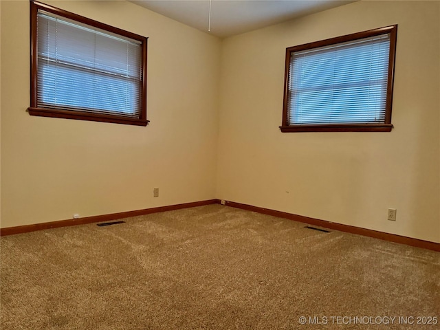 spare room with carpet floors