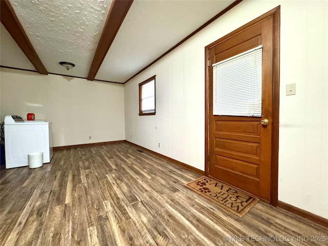 entryway with washer / dryer and dark wood-type flooring