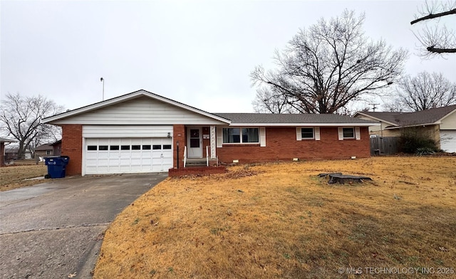 single story home with a garage and a front lawn