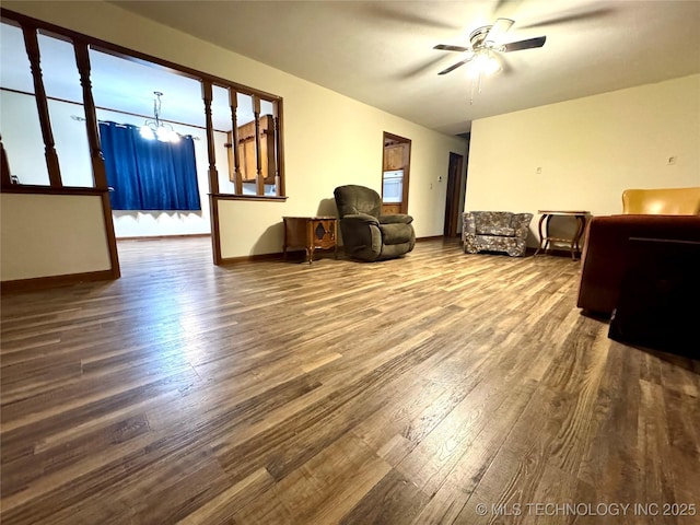 living room with hardwood / wood-style flooring and ceiling fan