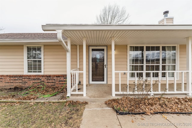 entrance to property with a porch