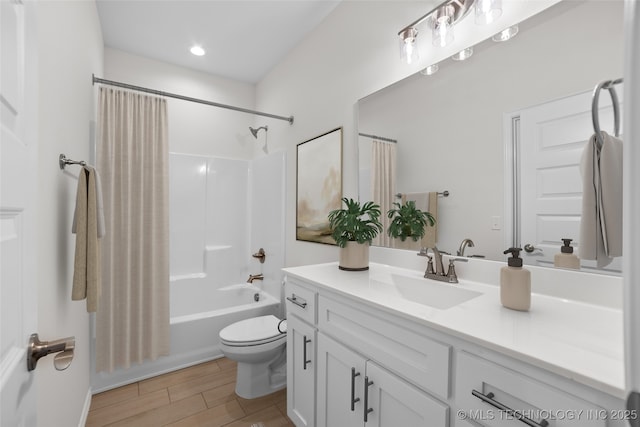 full bathroom featuring shower / tub combo with curtain, vanity, hardwood / wood-style flooring, and toilet