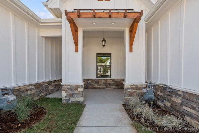 1941 W Huntsville Pl, Broken Arrow, OK 74011 - doorway to property featuring board and batten siding and stone siding